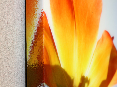 Corner detail of a canvas print coated in resin
