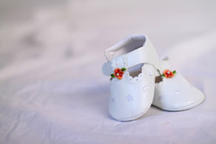 A picture of a little pair of children's baptism shoes