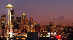 A skyline image of Seattle, Washington at sunset