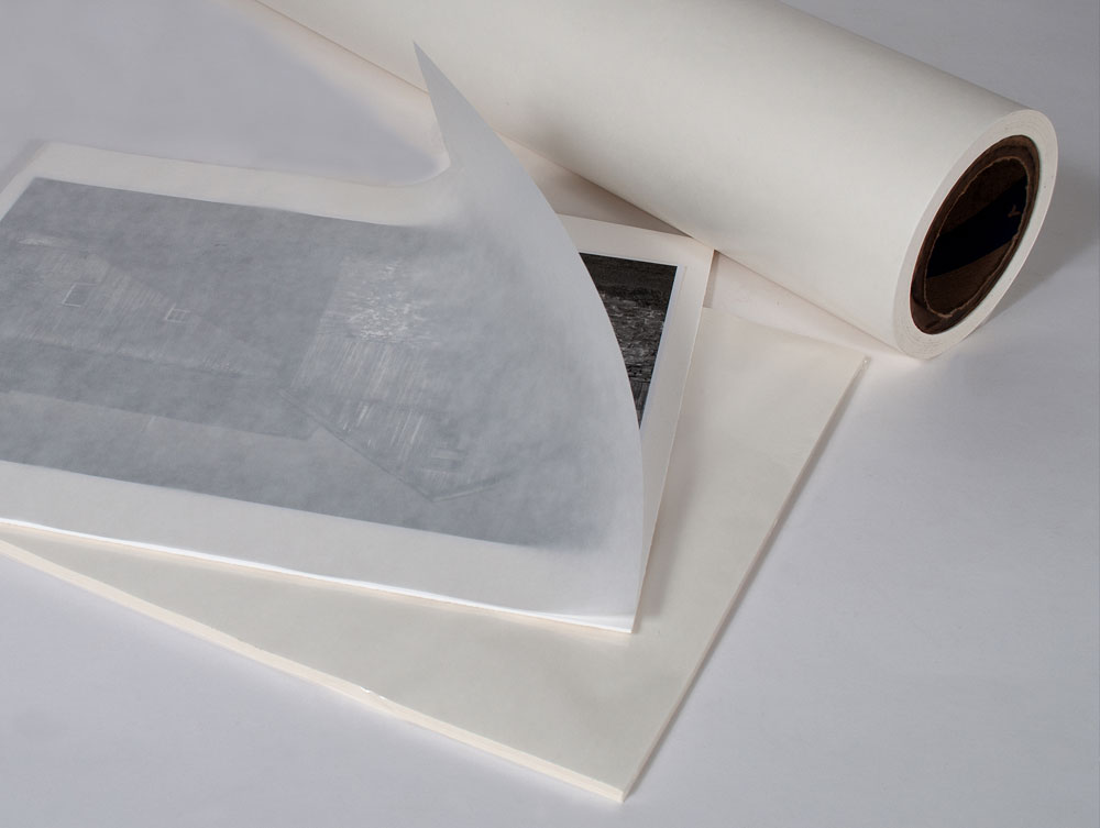 Use Glassine paper to separate your prints.
