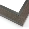 This unique frame with a raw wood face features long edge grain texture and a deep brown wash.  The frame forms a shallow V, with the matte black inner lip sloping out and then rising again (see illustration). The outer drop edge is also matte black.

2 " width: ideal for medium size artwork.  The modern style of this frame makes it a great match to more contemporary paintings and photography.